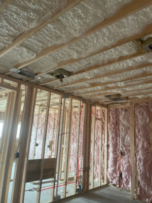 Open cell spray foam insulation with fiberglass interior walls.