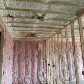 Open cell spray foam insulation with fiberglass interior walls