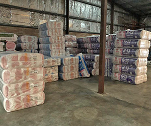 Piles of packaged fiberglass materials in the ABS Coastal warehouse.