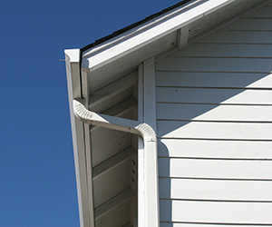 White gutter pipe on a white home.