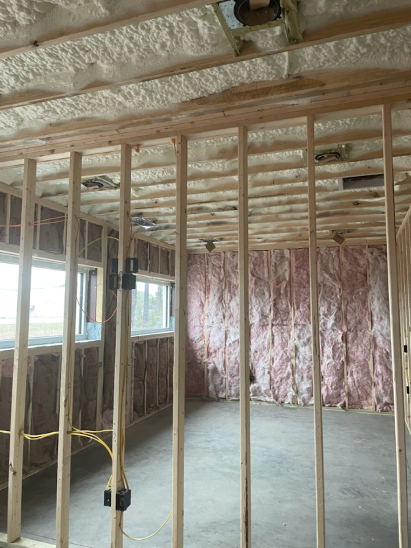 Open cell spray foam insulation with fiberglass interior walls