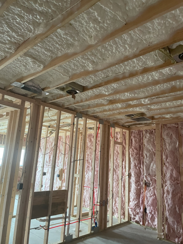 Open cell spray foam insulation with fiberglass interior walls