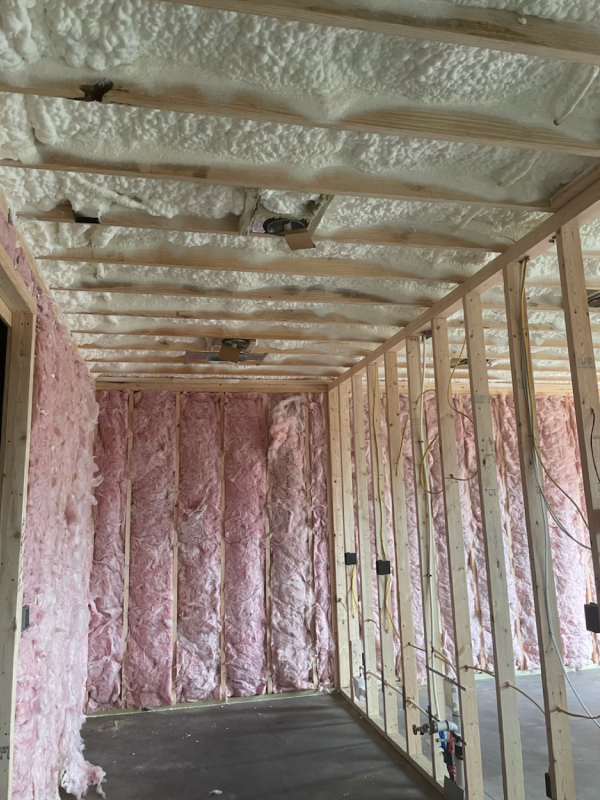 Open cell spray foam insulation with fiberglass interior walls